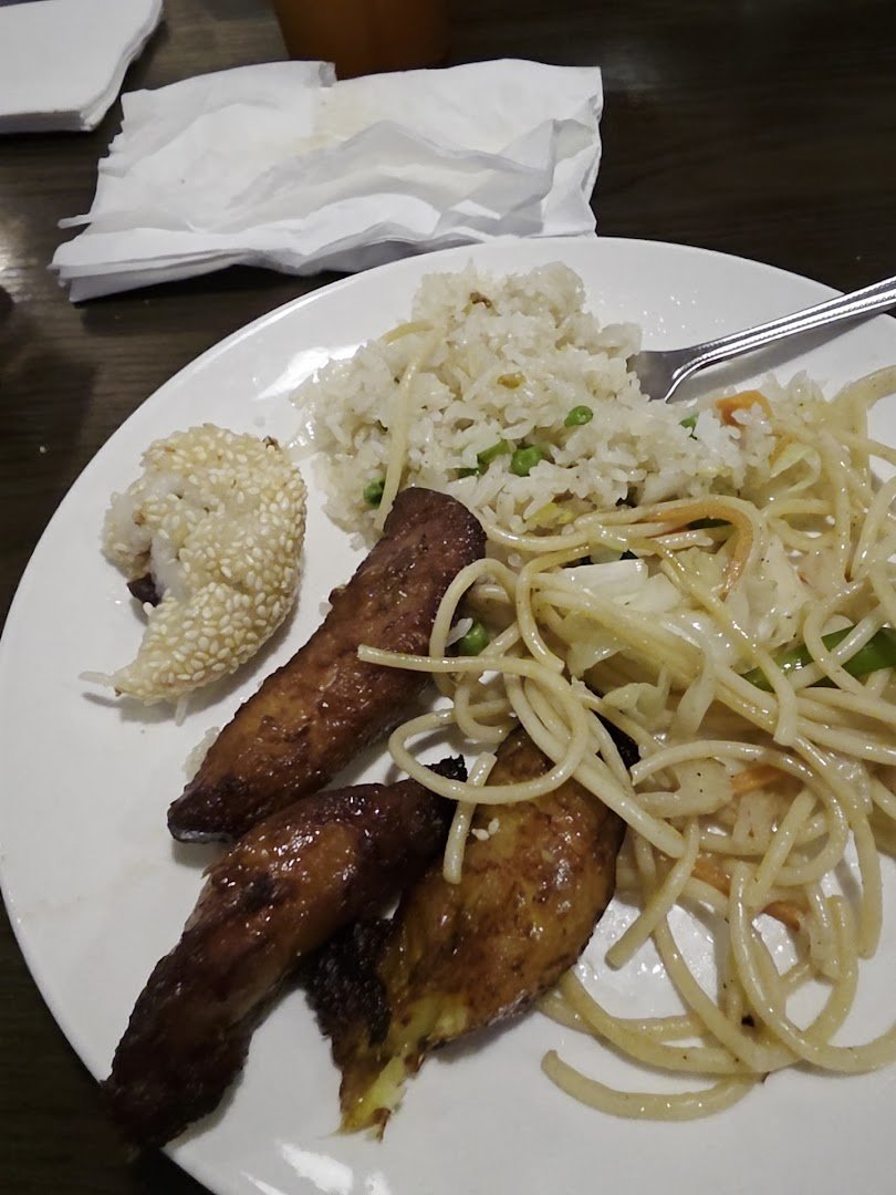 Hot dishes arranged behind a serving line.